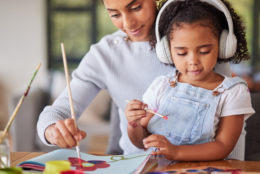 Autism is estimated to affect one in 36 American children.  Here, a Brazilian woman bonds with her daughter, who is listening to a podcast about autism.